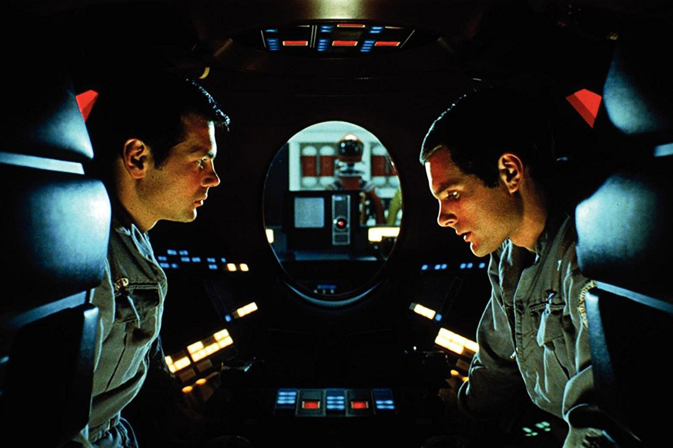 Gary Lockwood and Keir Dullea converse while HAL 9000 lip reads in 2001: A Space Odyssey (1968)