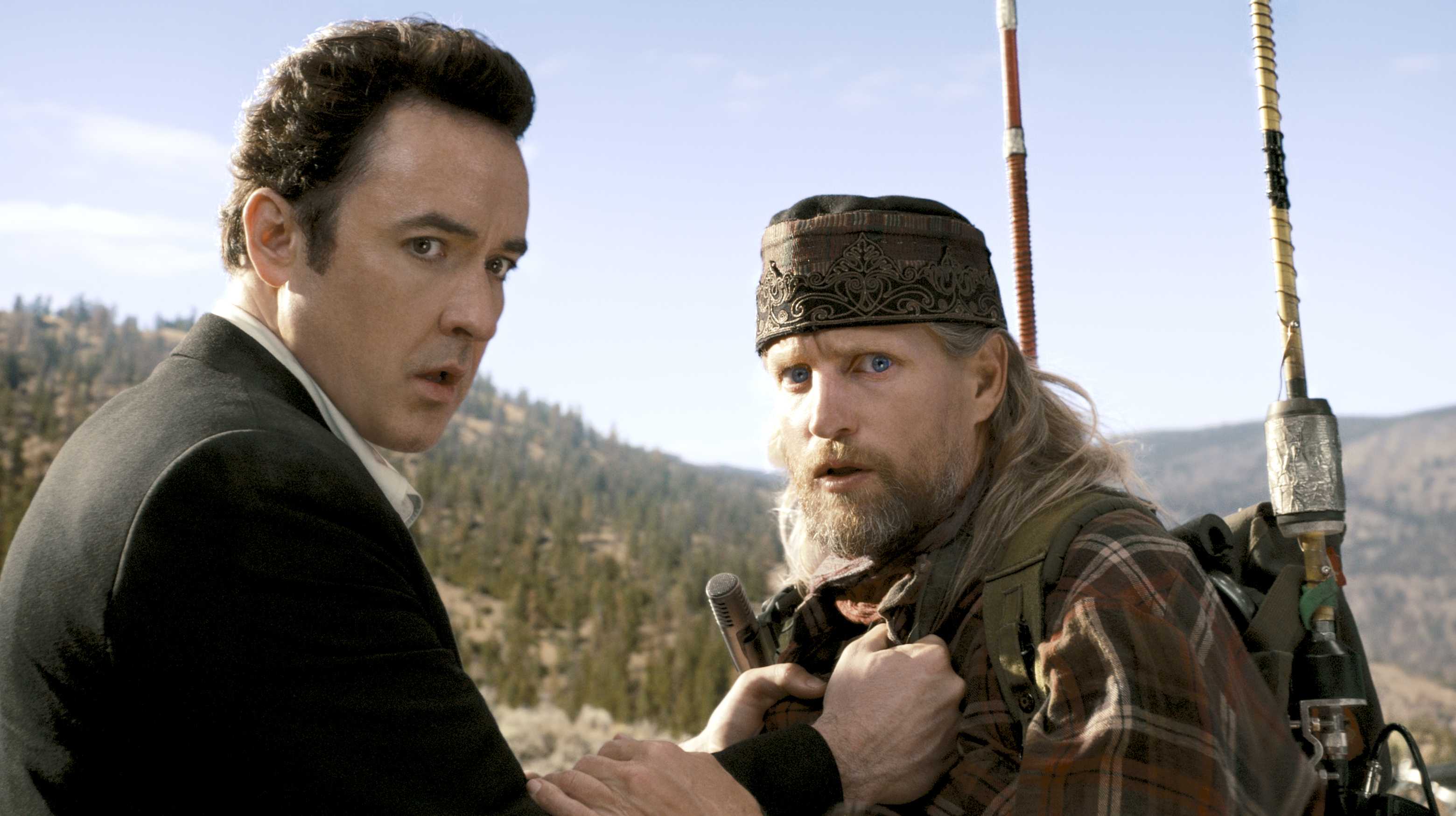 Science-fiction writer John Cusack and crackpot radio talkback host Woody Harrelson in 2012 (2009)