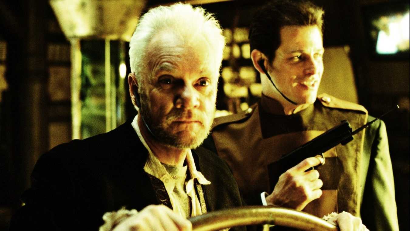 (l to r) Ship's captain Malcolm McDowell and security head Michael Paré in 2103: The Deadly Wake (1996)