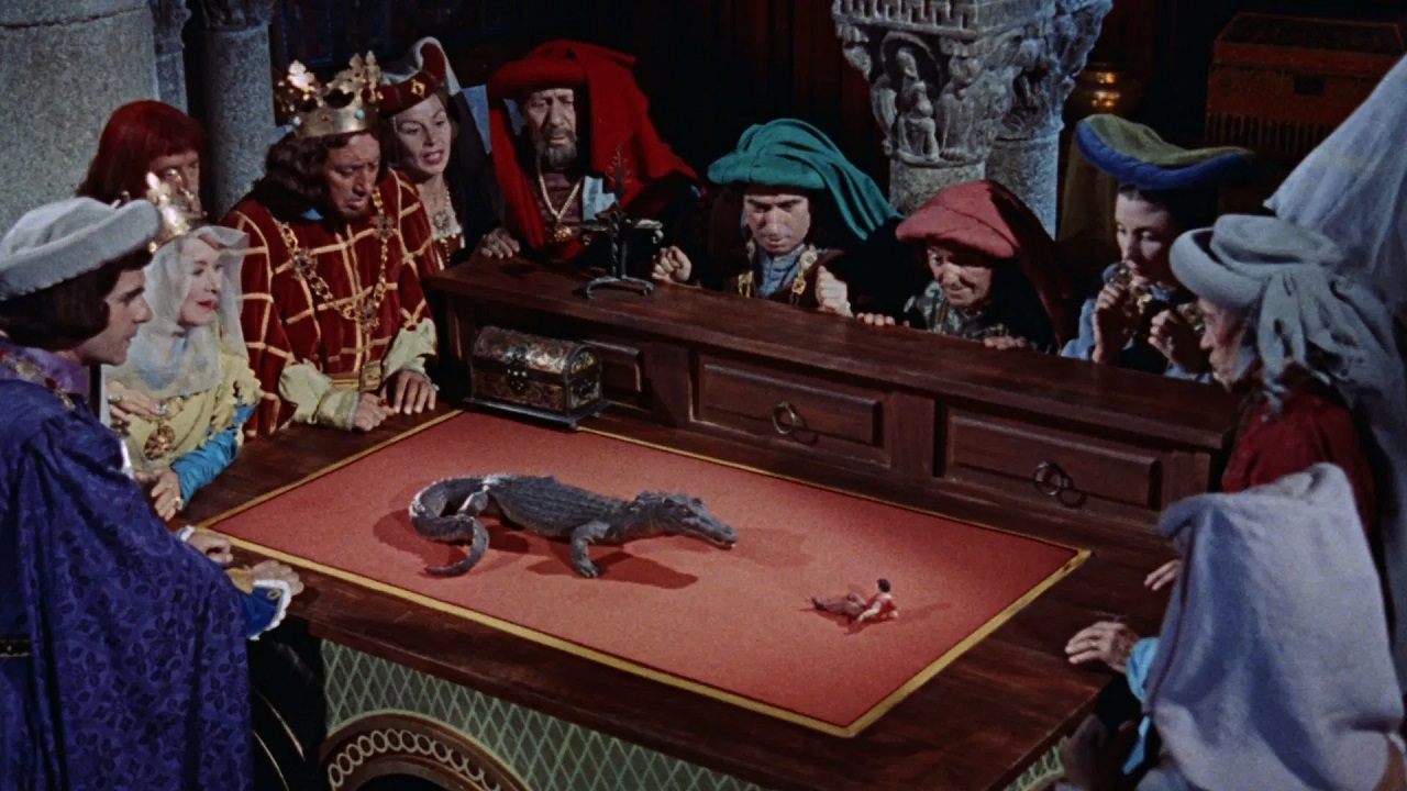 Gulliver (Kerwin Mathews) forced to fight a crocodile in Brobdingnag in The 3 Worlds of Gulliver (1960)