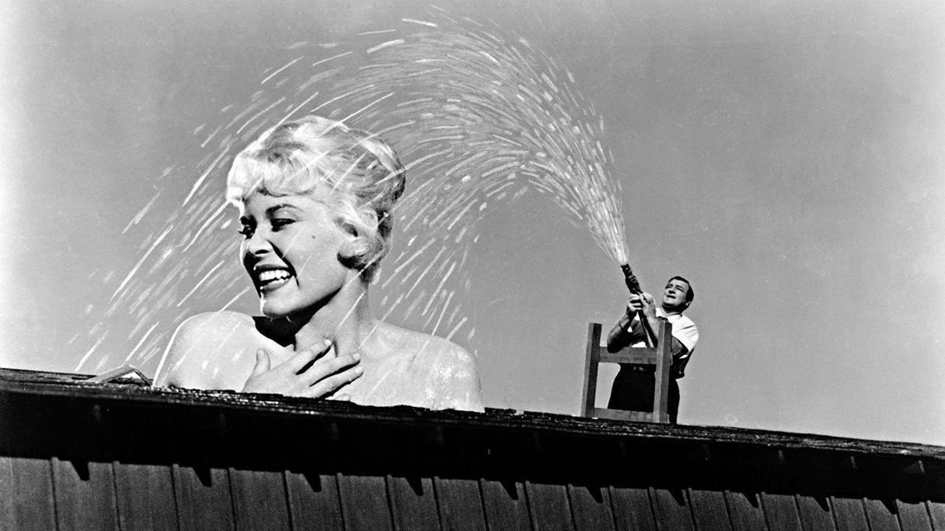 Lou Costello gives his giant-sized wife (Dorothy Provine) a shower in The 30 Foot Bride of Candy Rock (1959)