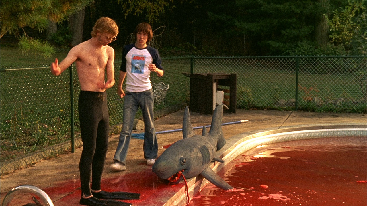 Pat Johnson (John Francis Daley) and best friend Bill Holmes (Steve Couter) shoot a homemade version of Jaws in the swimming pool in 5-25-77 (2022)