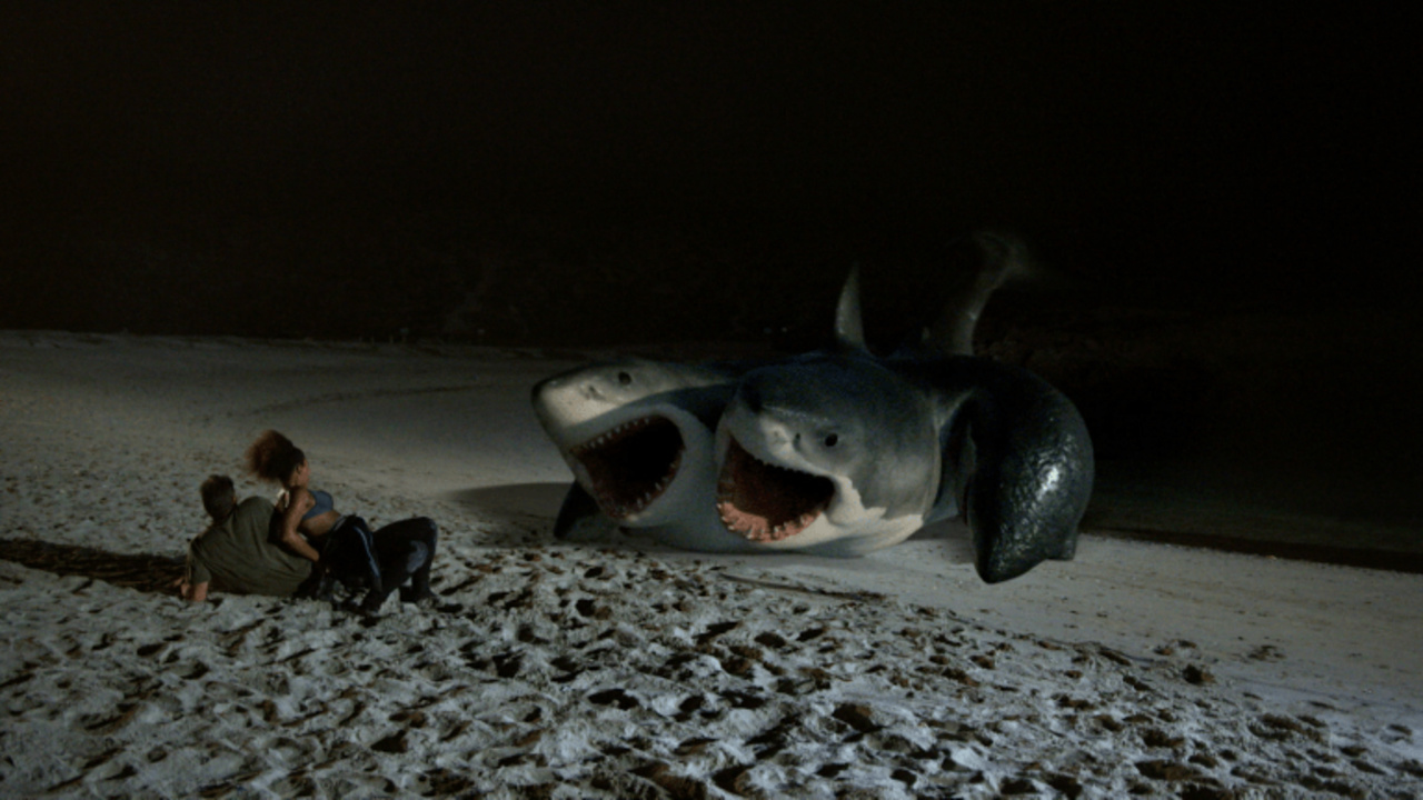 The six-headed shark emerges onto the beach to attack in 6-Headed Shark Attack (2018)