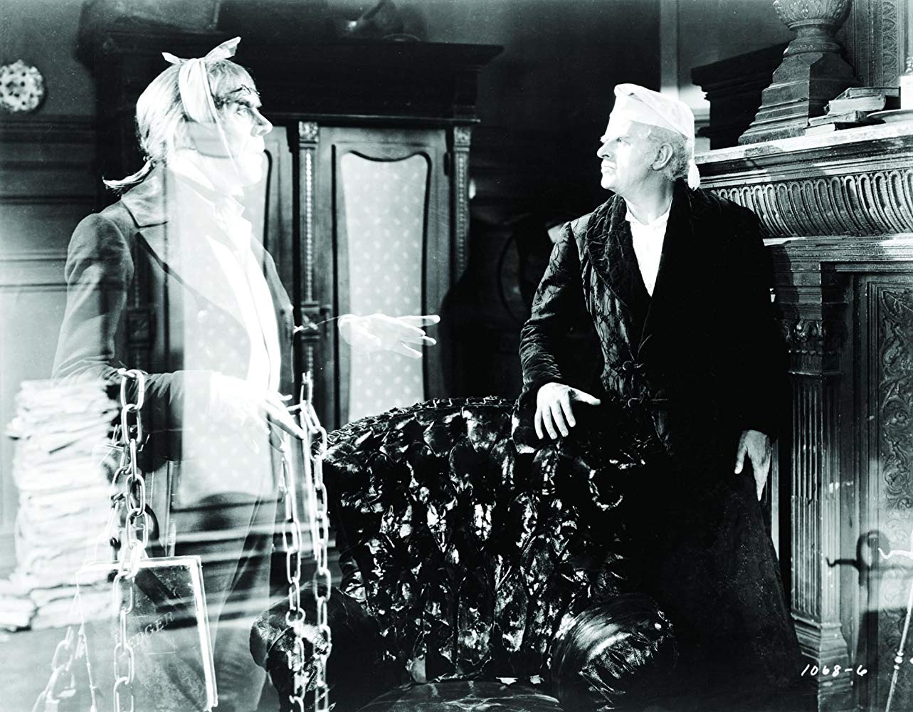 Scrooge (Reginald Owen) and the ghost of Jacob Marley (Leo G. Carroll) in A Christmas Carol (1938)