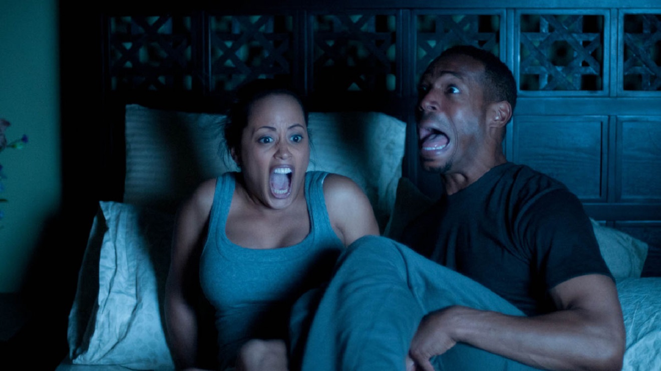 Marlon Wayans and wife Essence Atkins find they are haunted by a paranormal entity in A Haunted House (2013)