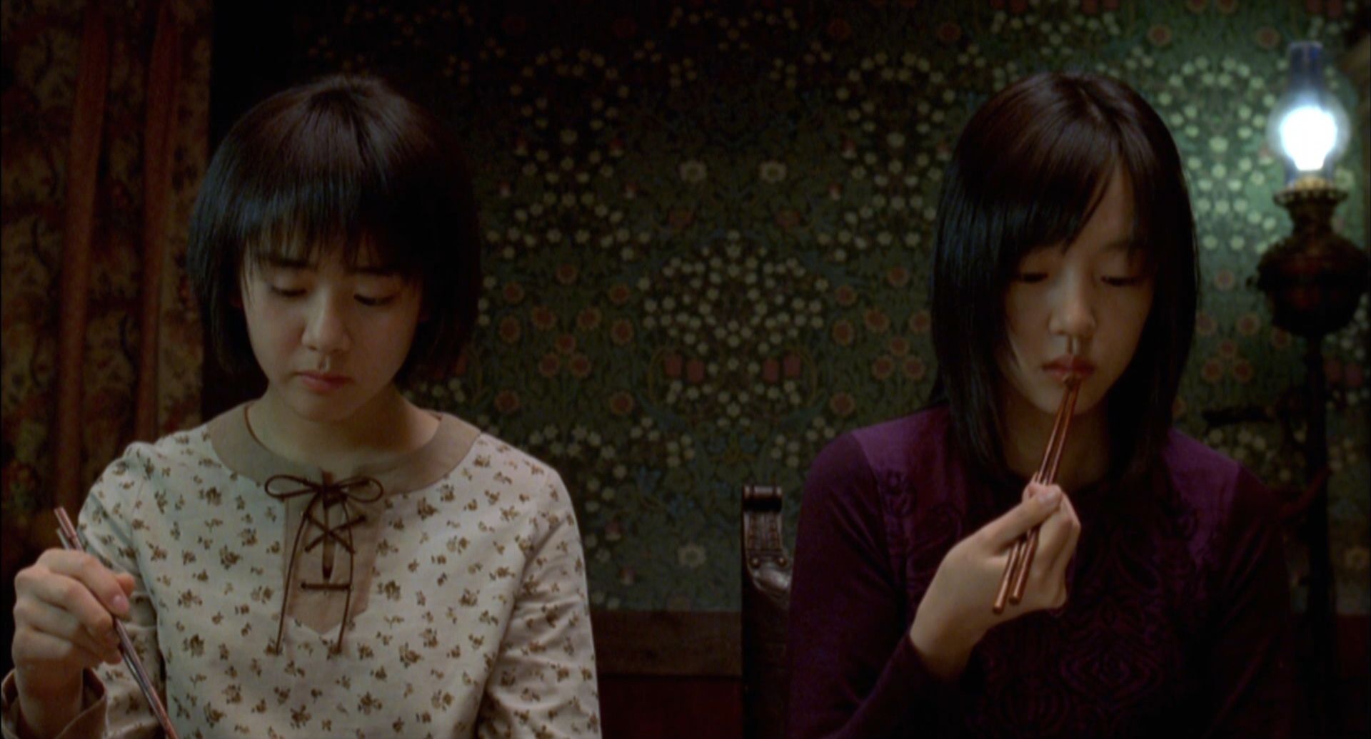Im Soo-jung and her younger sister Moon Geun-young in A Tale of Two Sisters (2003)