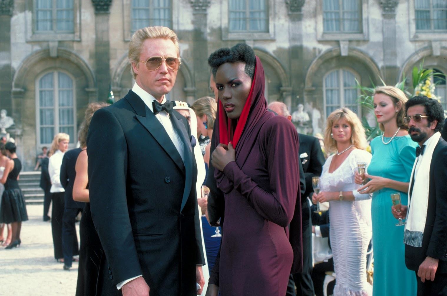 Christopher Walken as tech billionnaire villain Max Zorin with Grace Jones as henchwoman May Day in A View to a Kill (1985)