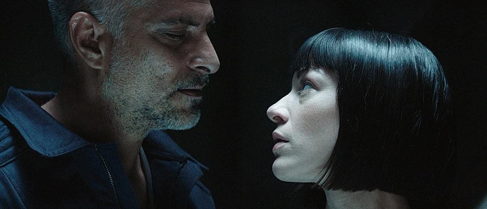 The astronaut Milutin (Sebastian Cavazza) and the android Nimani 1345 (Stoya) in A.I. Rising (2018)