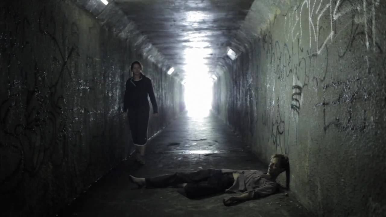 Katie Parker encounters Doug Jones in the walkway tunnel in Absentia (2011)