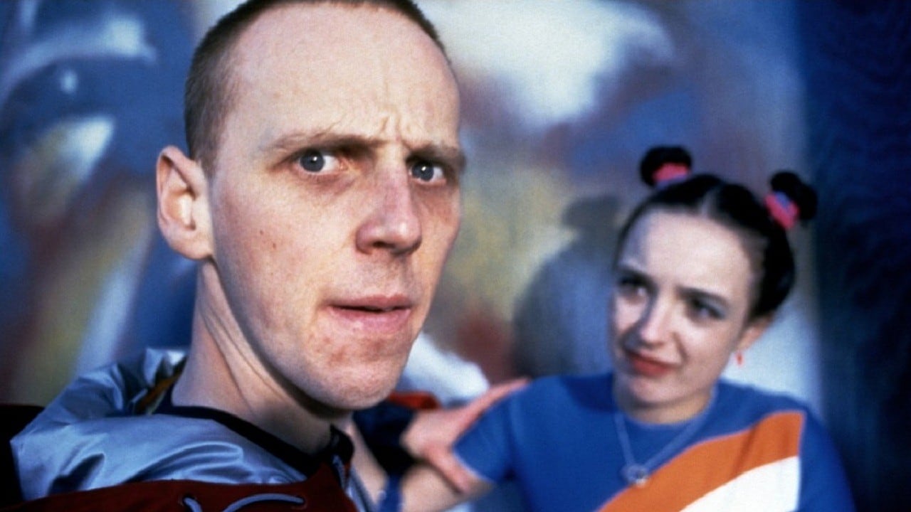 Ewen Bremner as the man who has swapped minds with a baby, and Arlene Cockburn in The Acid House (1998)