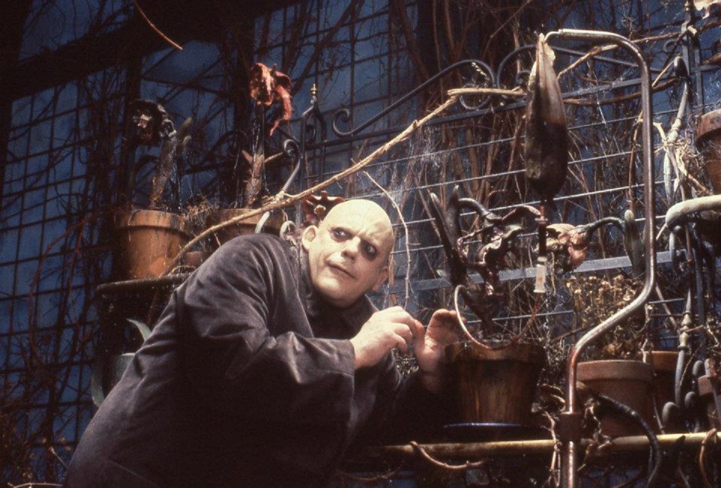 Uncle Fester (Christopher Lloyd) conducts mad science in The Addams Family (1991)