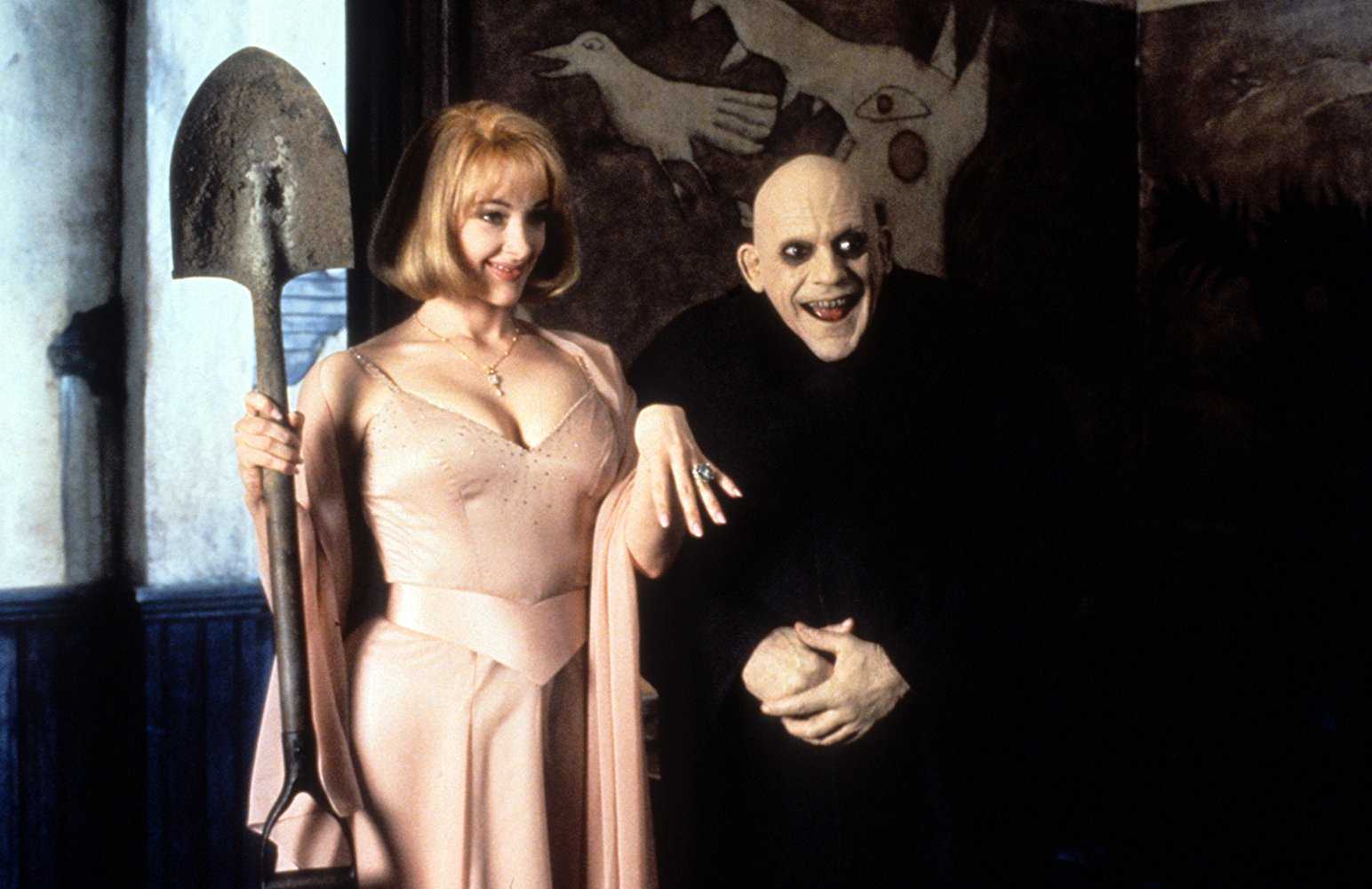 Uncle Fester (Christopher Lloyd) and his new bride Debbie Jalinsky (Joan Cusack) in Addams Family Values (1993)