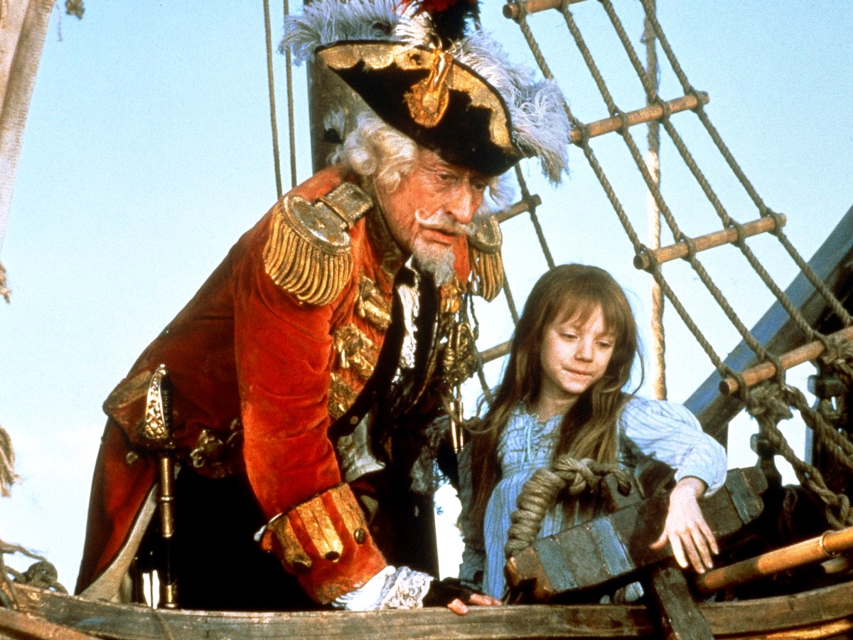 Baron Munchausen (John Neville) and his companion Sally Salt (a young Sarah Polley) in The Adventures of Baron Munchausen (1989)