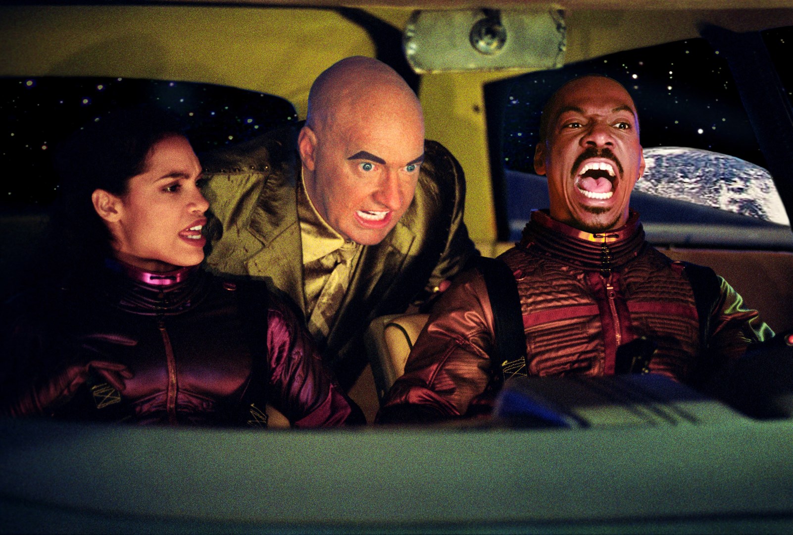 (l to r) Rosario Dawson, android Randy Quaid and Eddie Murphy on a Lunar journey in The Adventures of Pluto Nash (2002)