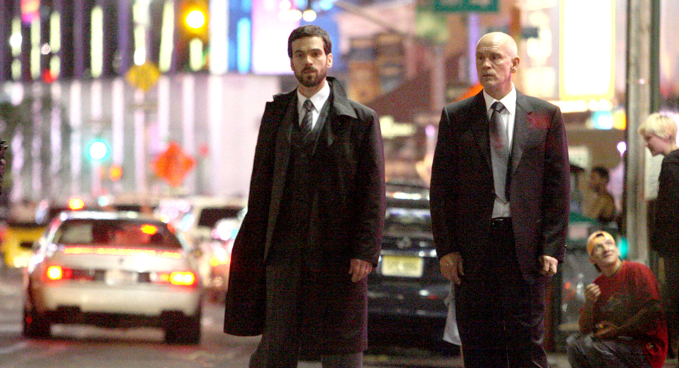 (l to r) Romain Duris and John Malkovich as the mysterious Messenger in Afterwards (2008)