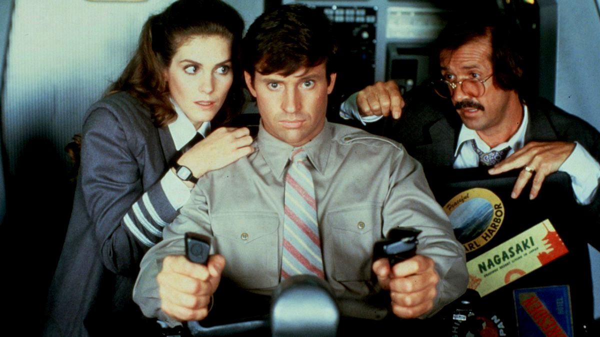 All aboard the shuttle - (l to r) air hostess Julie Hagerty and pilot Robert Hays returning from the first film, along with mad bomber Sonny Bono in Airplane II: The Sequel (1982)