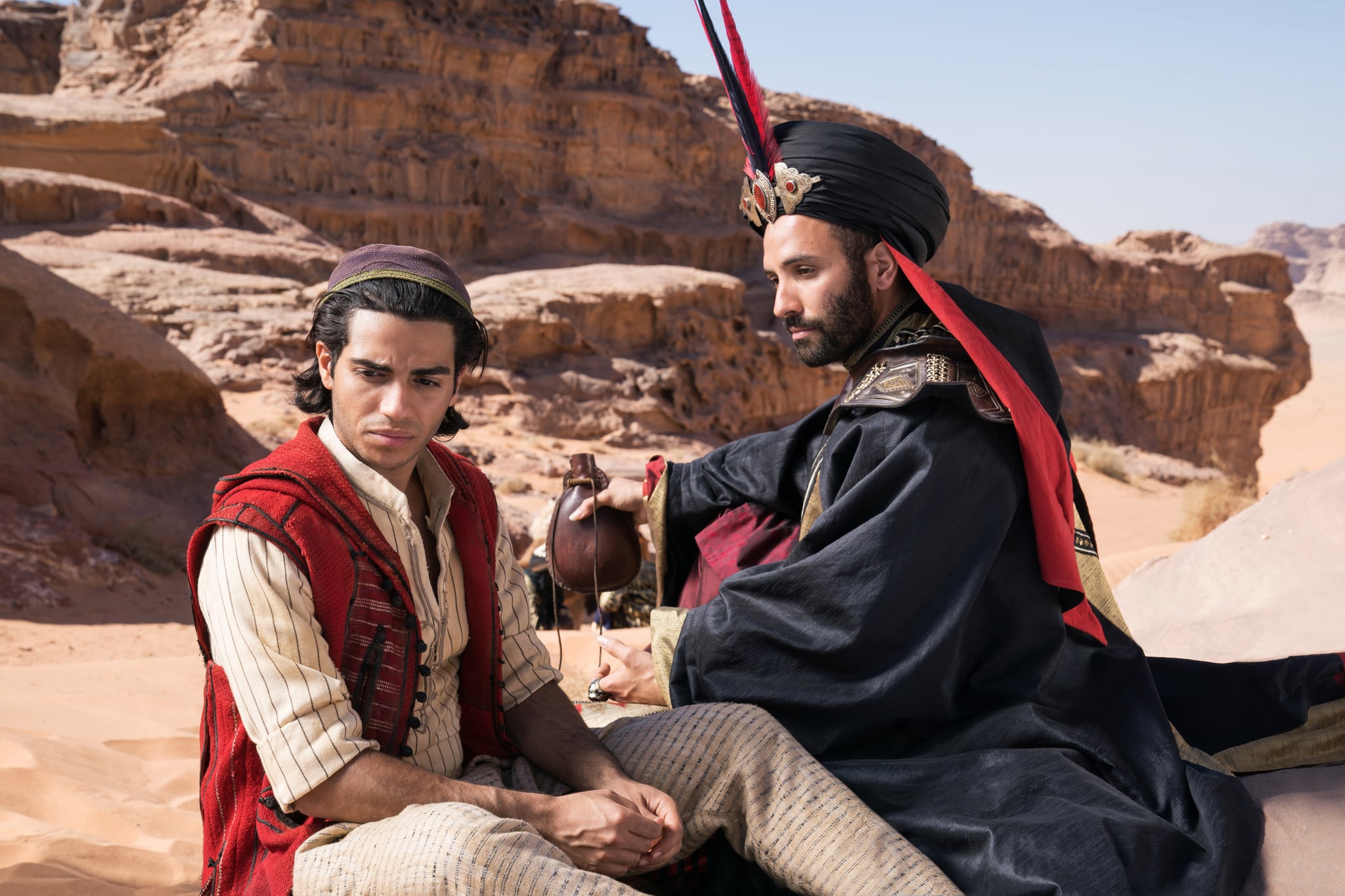 (l to r) Aladdin (Mena Massoud) is offered a deal by the vizier Jafar (Marwan Kenzari) in Aladdin (2019)