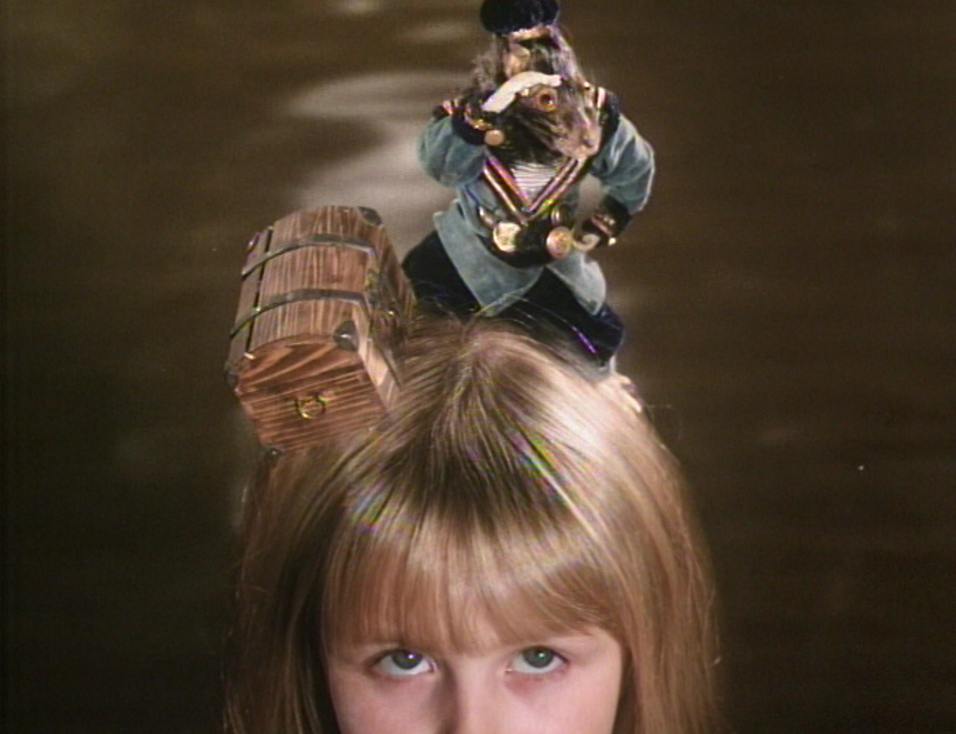 The dormouse sets up camp on Alice (Kristyna Kohoutova)'s head in Alice (1988)