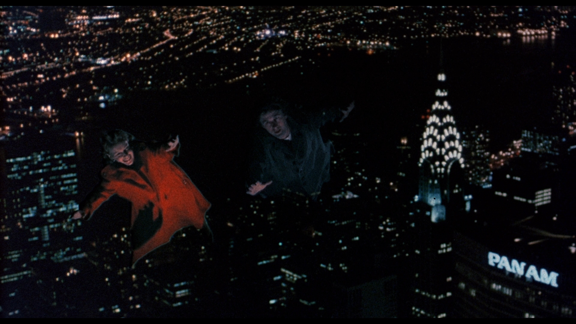 Alice (Mia Farrow) is taken on a flight through the night skies of Manhattan by a ghostly Alec Baldwin in Alice (1990)