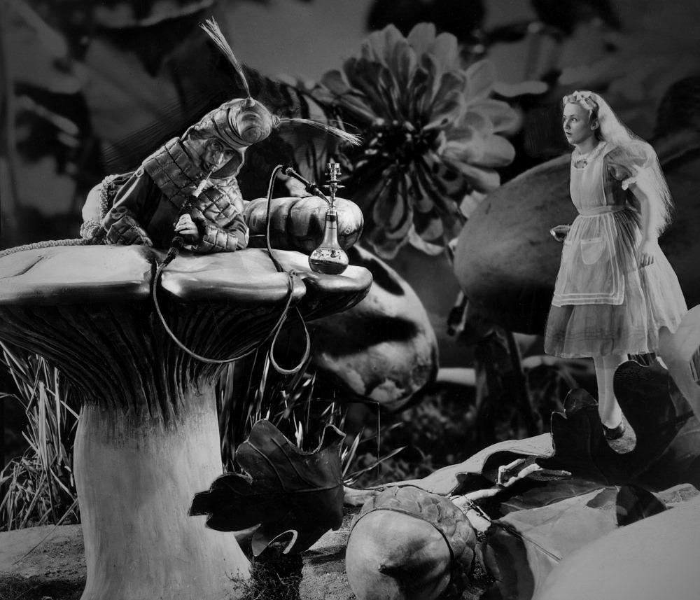 Alice (Charlotte Henry) meets The Caterpillar (Ned Sparks) in Alice in Wonderland (1933)