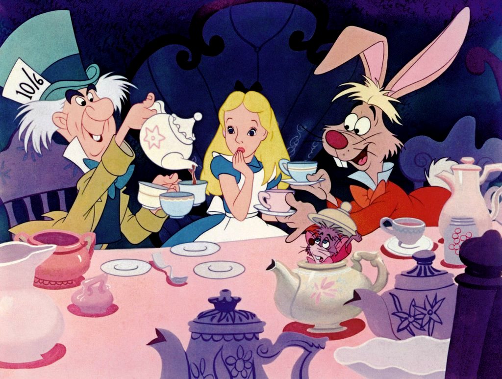 The Mad Hatter's Tea Party with (l to r) The Had Matter, Alice, The White Rabbit (and with the Dormouse hiding in the tea pot) in Alice in Wonderland (1951)