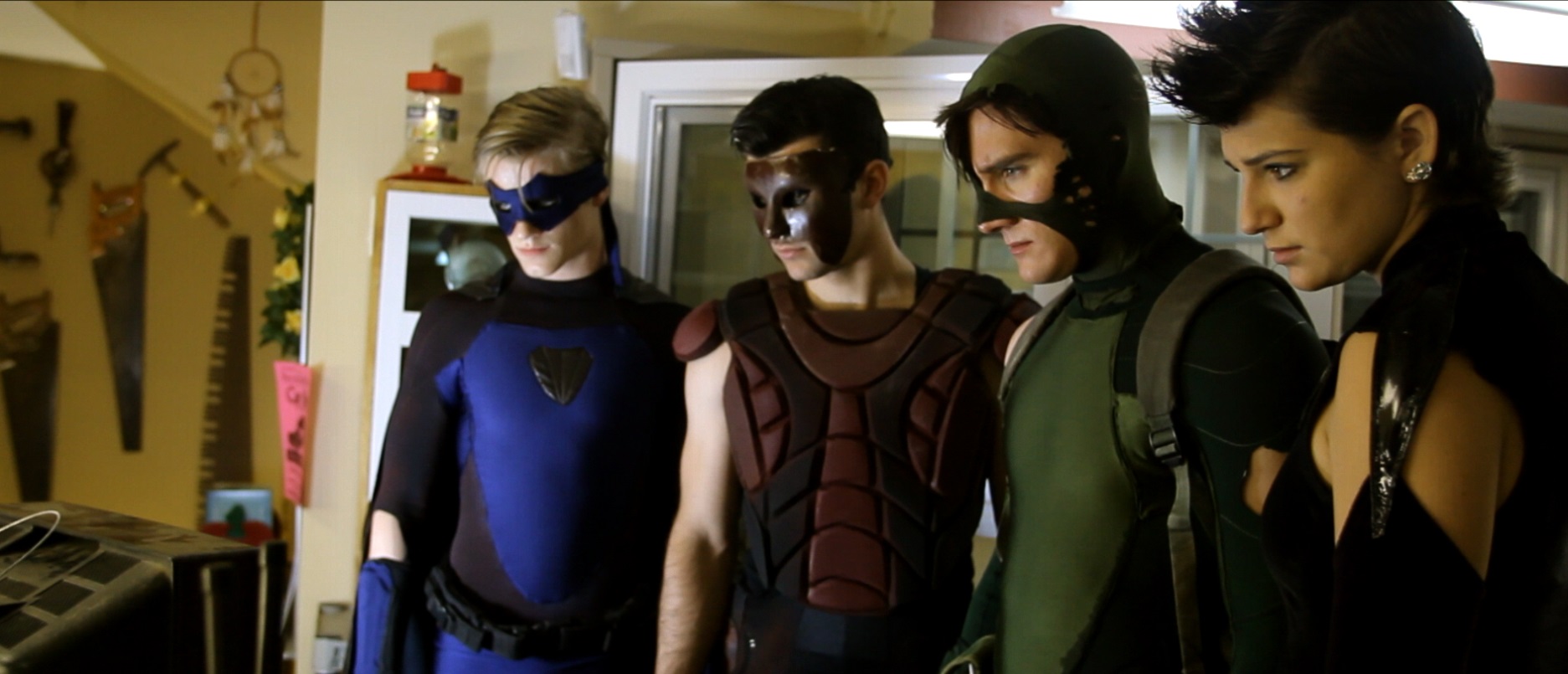 The superheroes - Cutthroat (Lucas Till), The Wall (Lee Valmassy), Charge (Jason Trost) and Shadow (Sophie Merkley) in All Superheroes Must Die (2011)