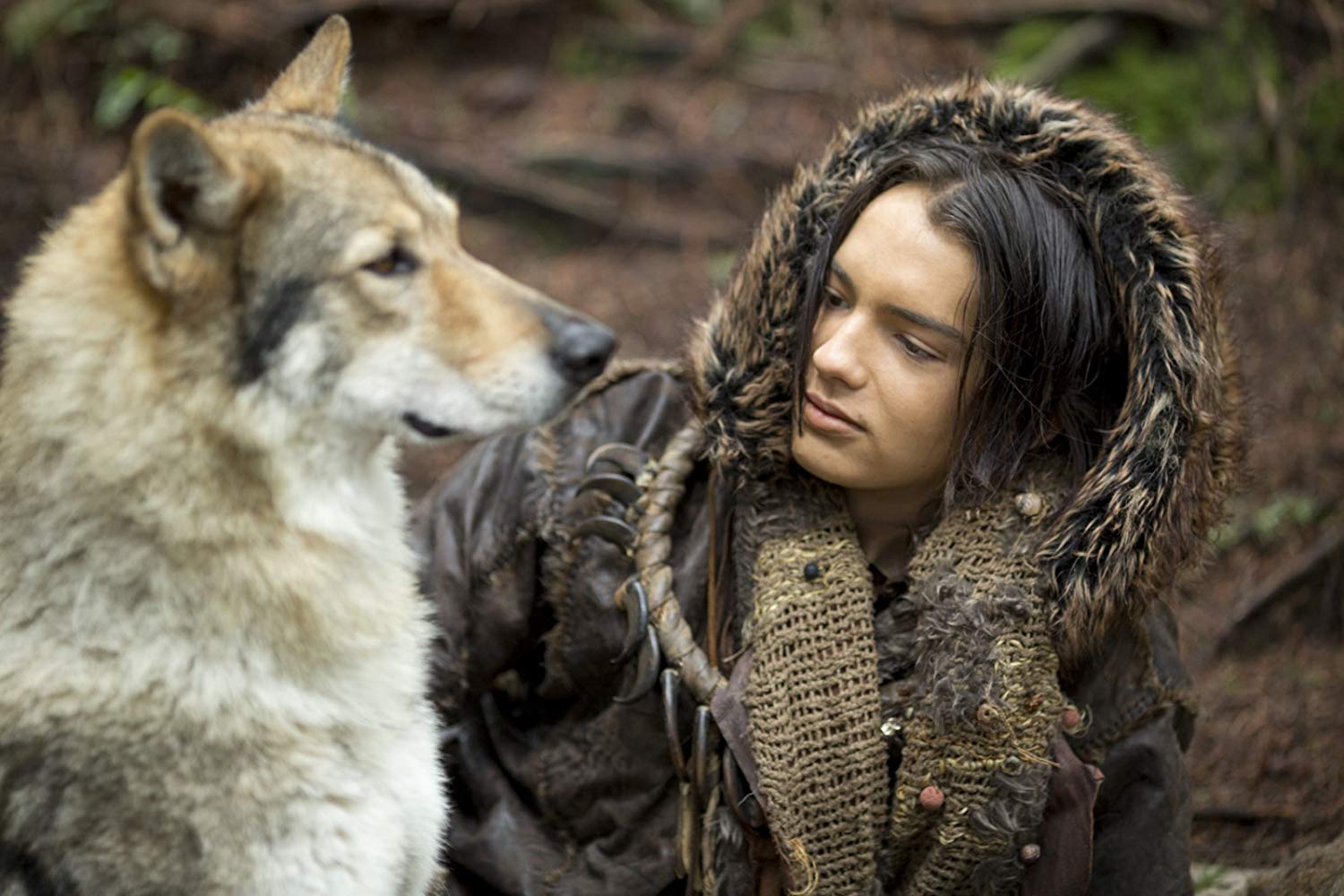 Kodi Smit-McPhee as Keda, along with Alpha the wolf in Alpha (2018)