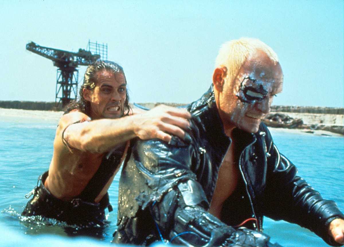 (l to r) Austin (Joe Lara) battles the killer cyborg (John P. Ryan) in American Cyborg: Steel Warrior (1992)