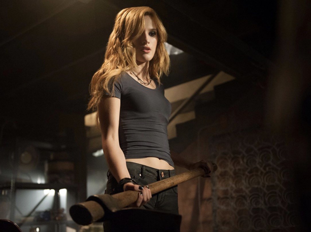 Bella Thorne wields an axe in Amityville: The Awakening (2017)