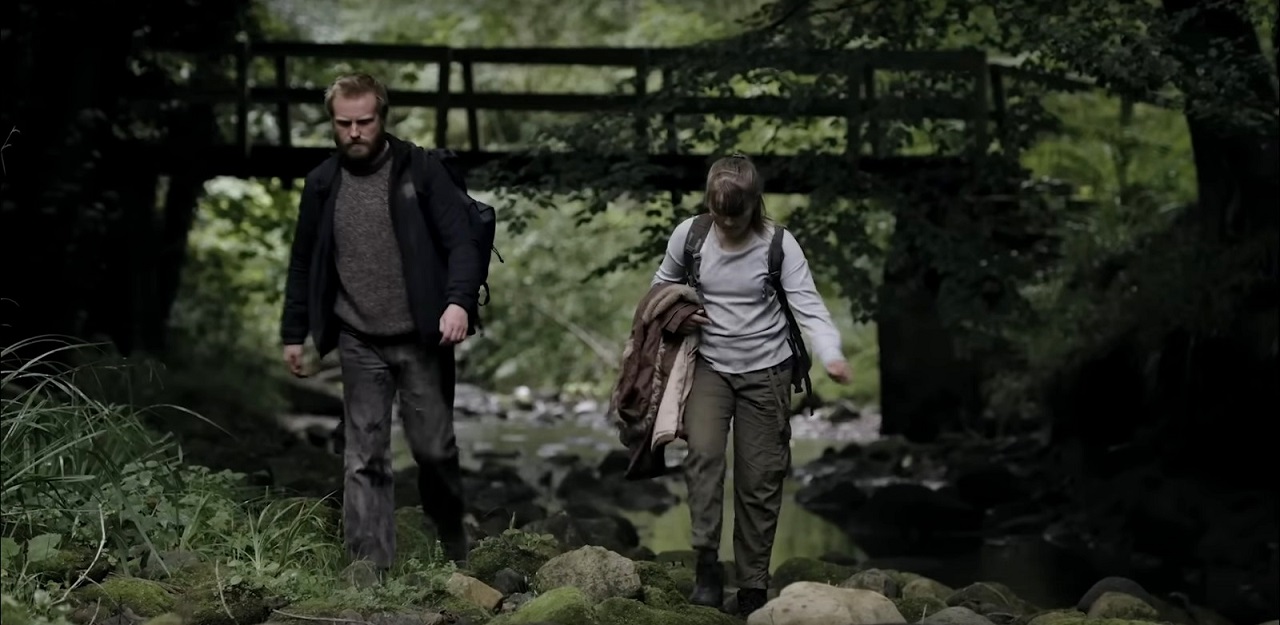 Harry (Dean Michael Gregory) and his sister Lily (Melissa Worsey) wander the post-apocalyptic landscape in Among the Living (2022)
