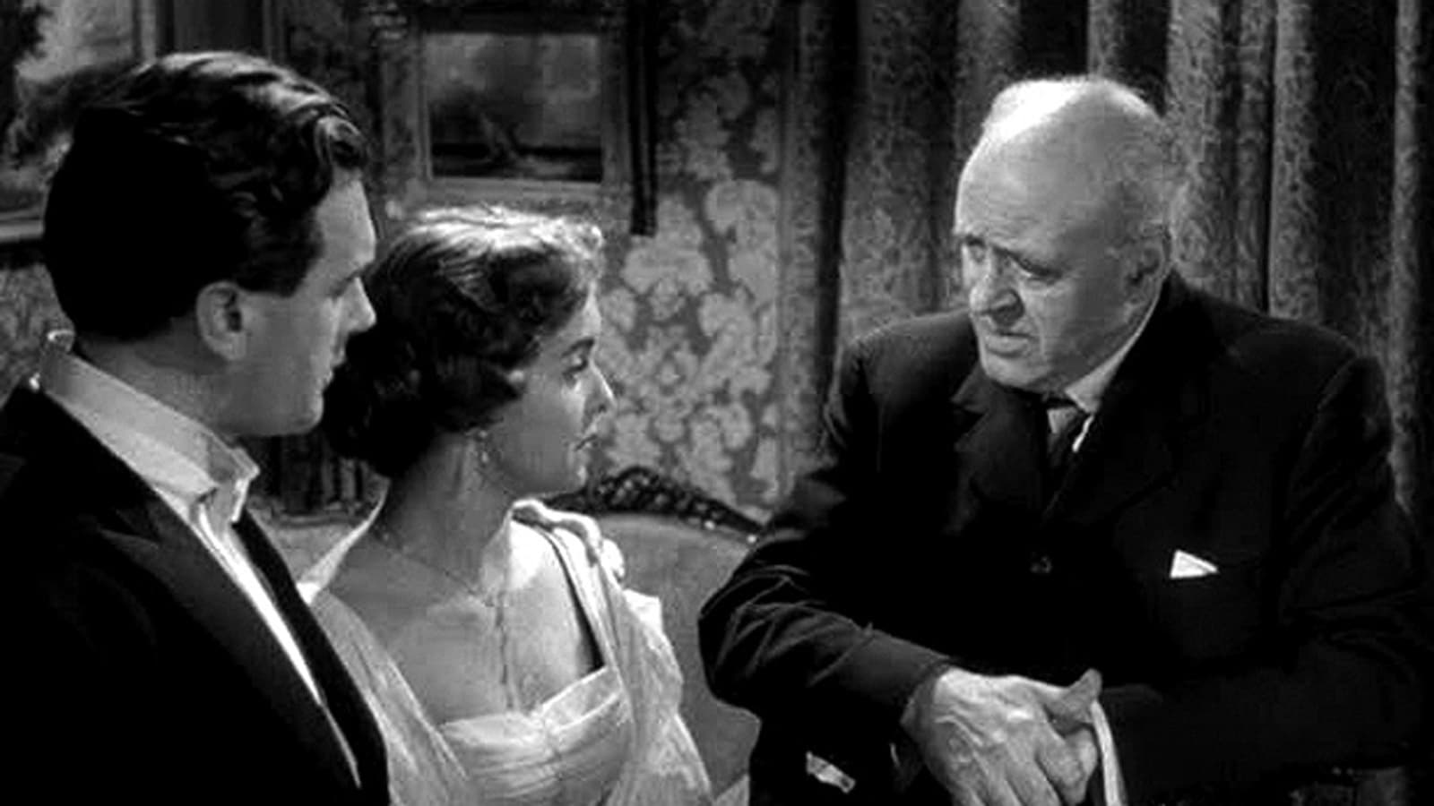 The Inspector (Alistair Sim) questions Brian Worth and Eileen Moore in An Inspector Calls (1954)