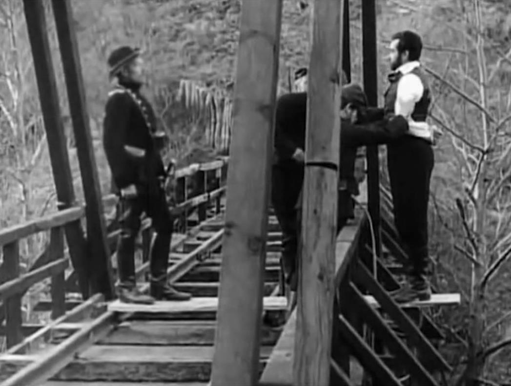 Confederate soldiers prepare to hang Roger Jacquet from bridge in An Occurrence at Owl Creek Bridge (1961) poster