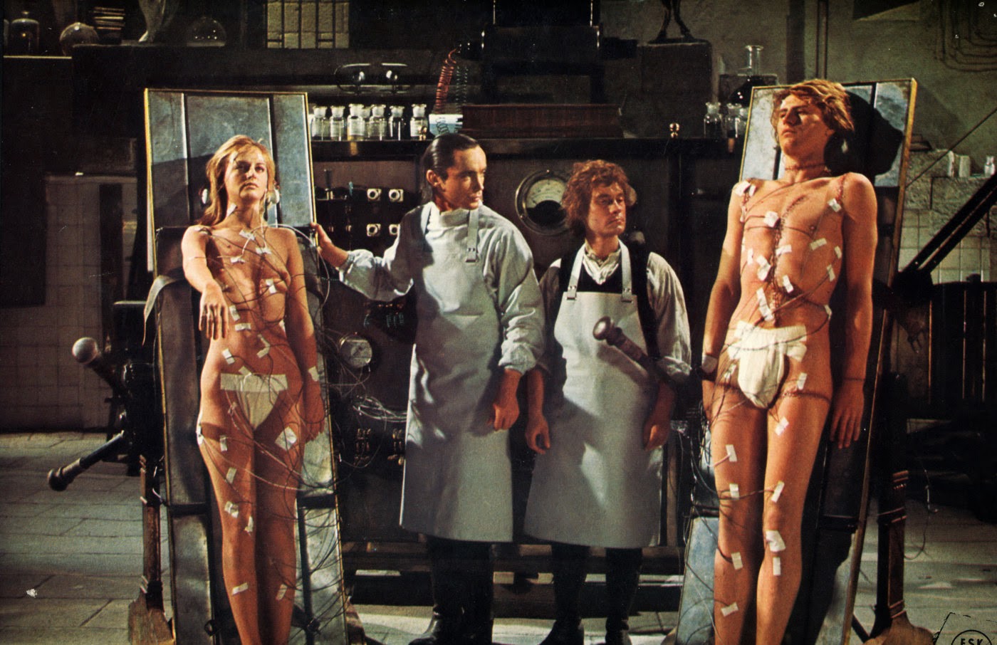 Baron Frankenstein (Udo Kier) with assistant Otto (Arno Juerging) flanked by his female (Dalila Di Lazzaro) and male (Srdjan Zelenovic) creations in Andy Warhol's Frankenstein (1973)