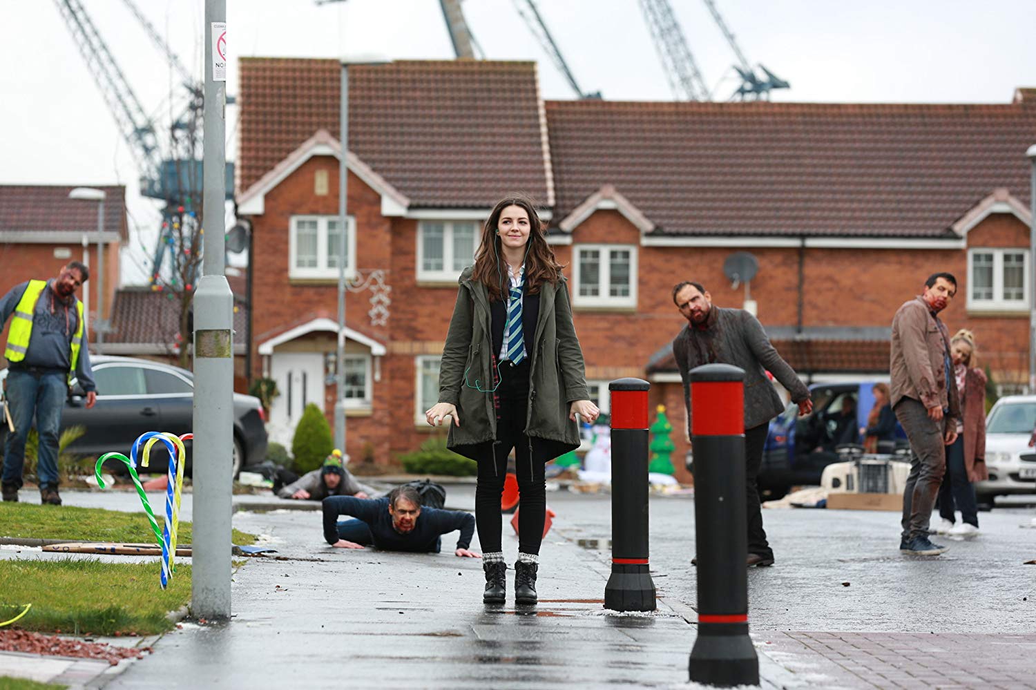 Anna (Ella Hunt) sets off on her school day unnoticing of the zombie apocalypse around her in Anna and the Apocalypse (2017)