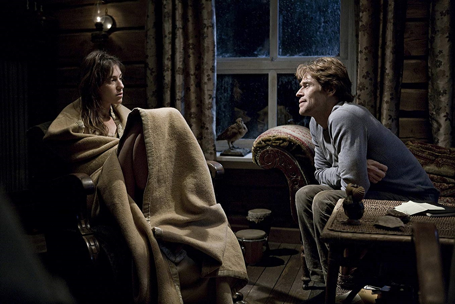 Willem Dafoe tries to console disturbed wife Charlotte Gainsbourg in Antichrist (2009)