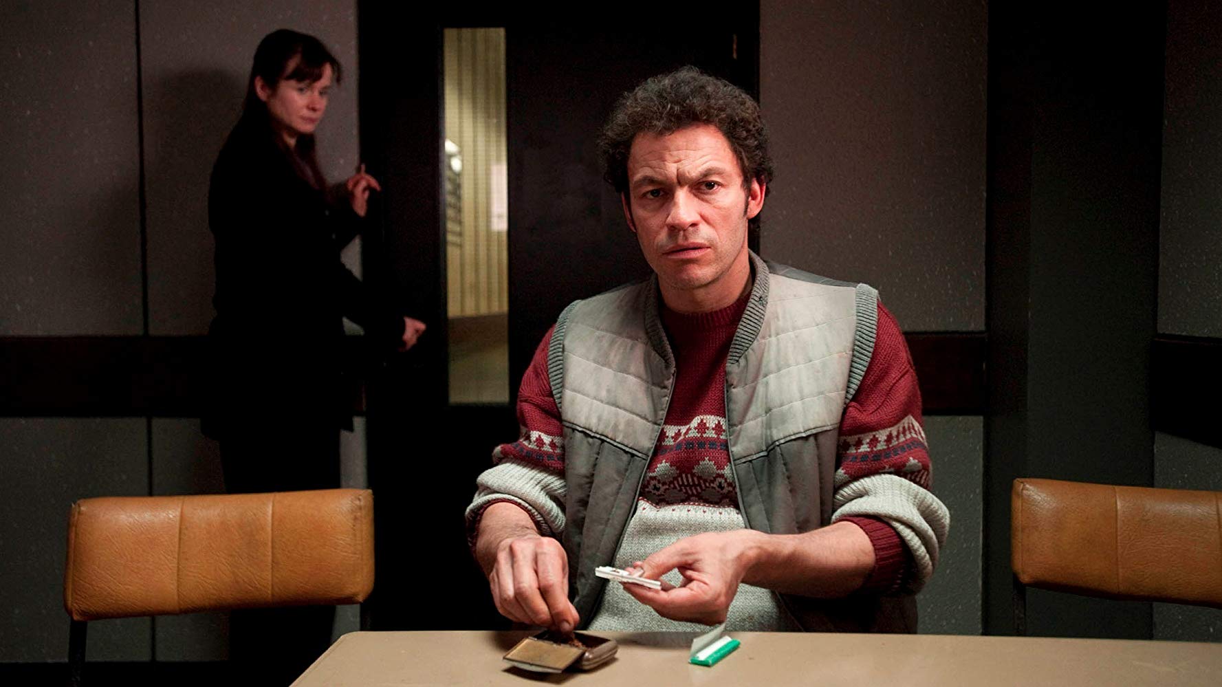 Dominic West as serial killer Fred West with Emily Watson in the background in Appropriate Adult (2011)