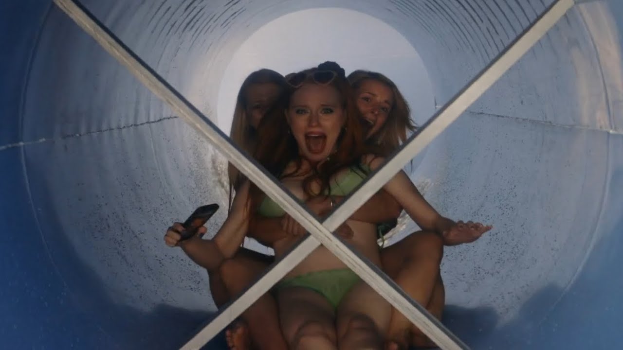 Girls head don the waterslide towards the waiting blades in Aquaslash (2019)