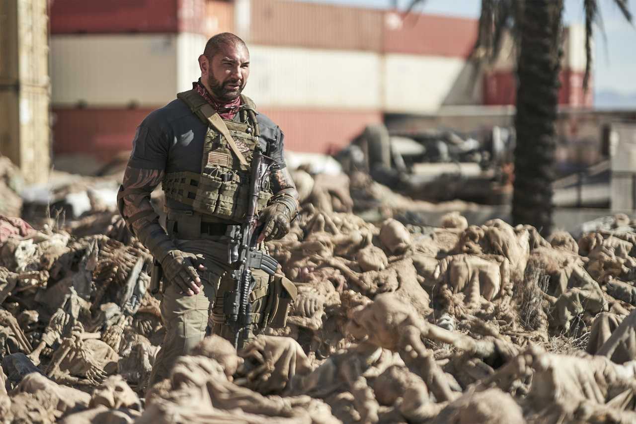 Dave Bautista amid the zombie dead in the ruins of Las Vegas in Army of the Dead (2021)