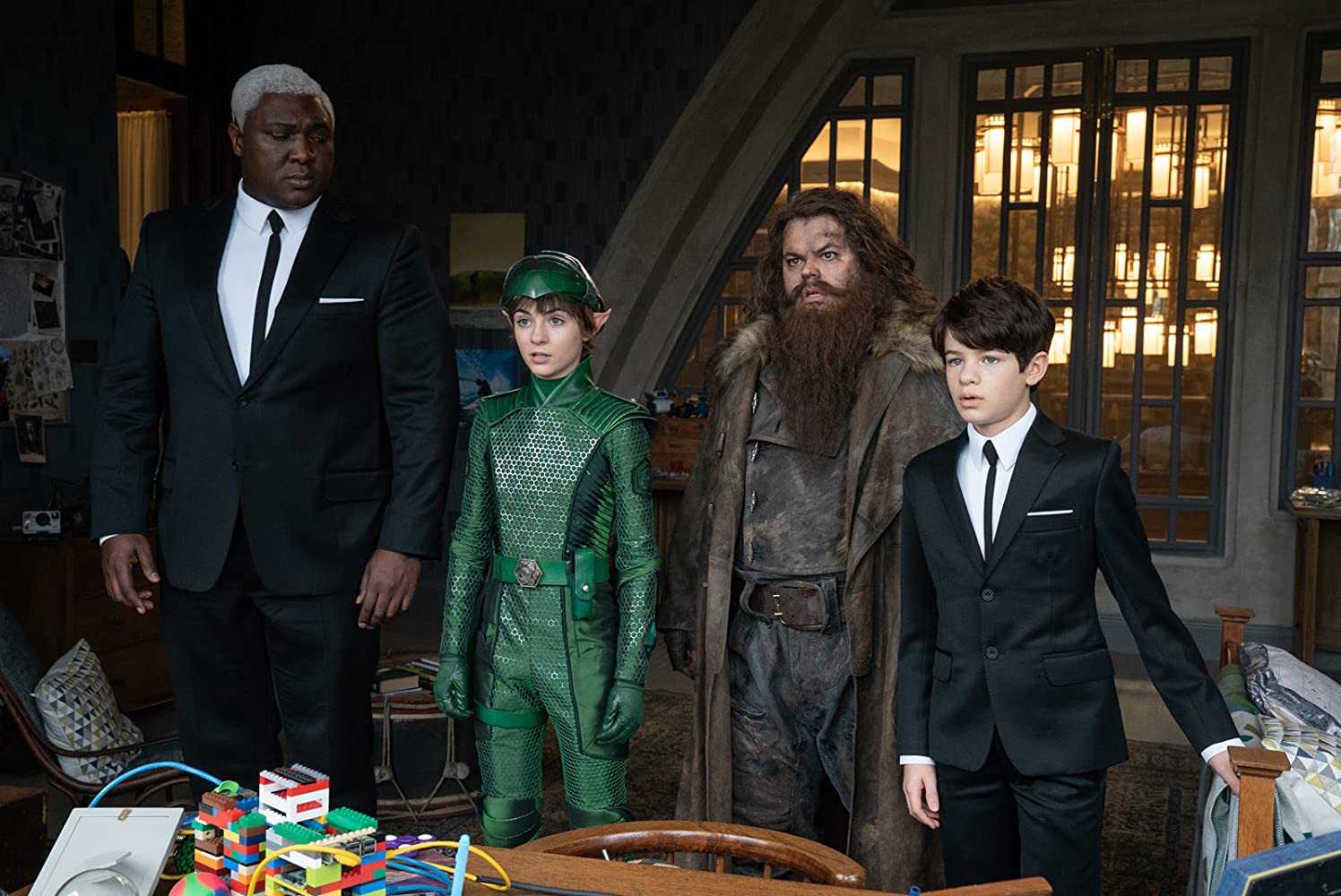 Domovol Butler (Nonso Anozie), the fairy Holly Short (Lara McDonnell), the giant dwarf Mitch Diggums (Josh Gad) and Artemis Fowl (Ferdia Shaw) in Artemis Fowl (2020)