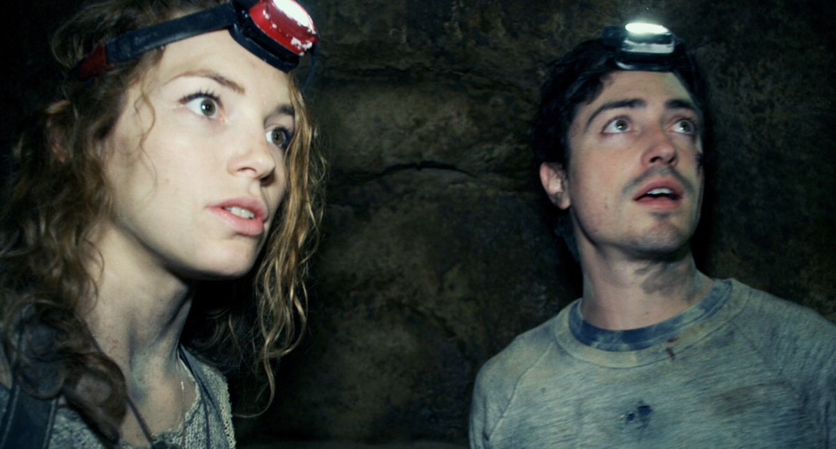 Perdita Weeks and Ben Feldman go exploring the catacombs beneath the streets of Paris in As Above, So Below (2014)