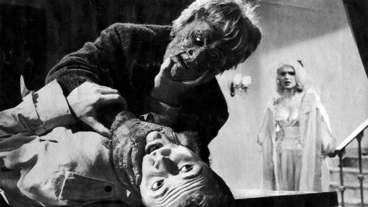 The transformed Alberto Lupo strangles a victim as Susanne Loret looks on in Atom Age Vampire (1960)