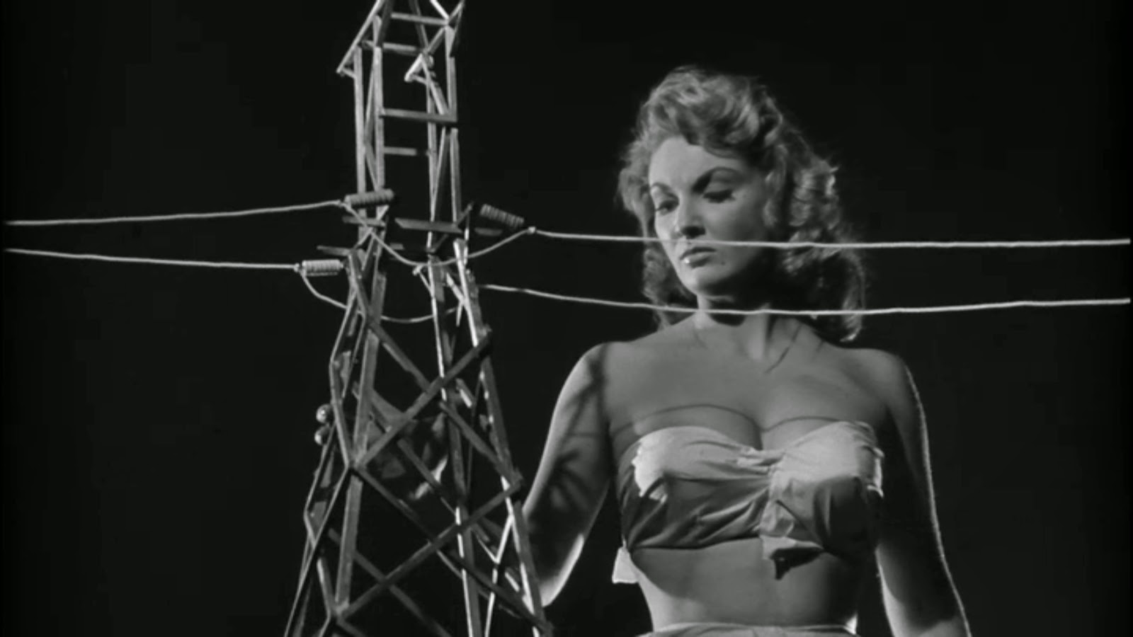 Allison Hayes rampages through town in Attack of the 50 Foot Woman (1958)