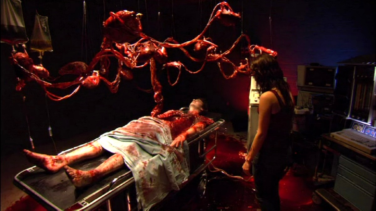 The medically absurd scene where Jessica Lowndes discovers boyfriend Ross Kohn with his organs strung up in Autopsy (2008)
