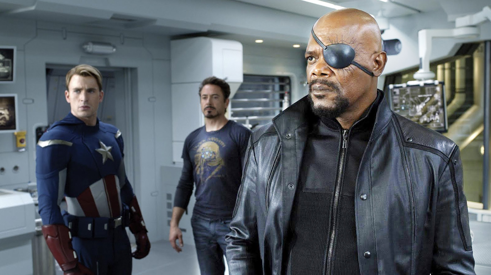 Chris Evans as Thor, Robert Downey Jr as Tony Stark and Samuel L. Jackson as Nick Fury in The Avengers (2012)