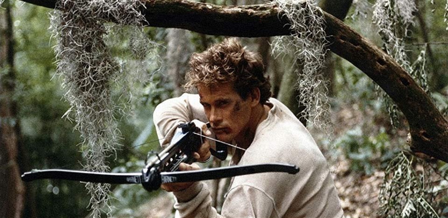 Michael Dudikoff forced to participate in a barehands survival hunt in the bayous in Avenging Force (1986)