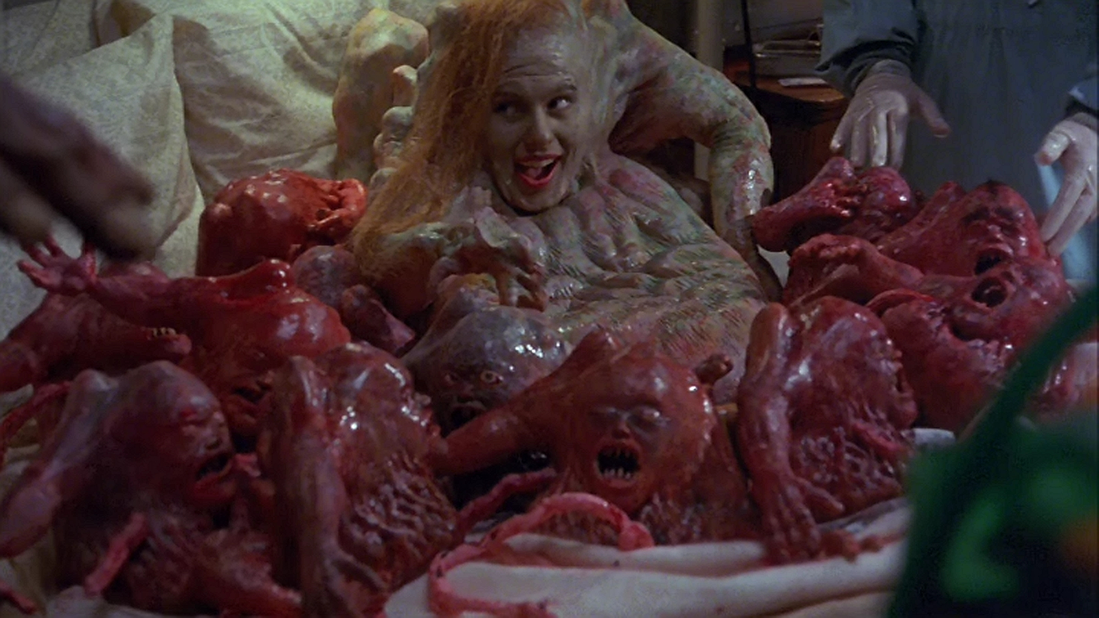 Eve (Denise Coop) gives birth to twelve baby Belials in Basket Case 3 (1991)