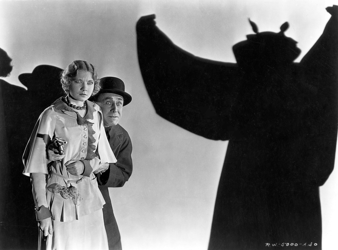 Una Merkel and detective Chance Ward face The Bat in The Bat Whispers (1930)