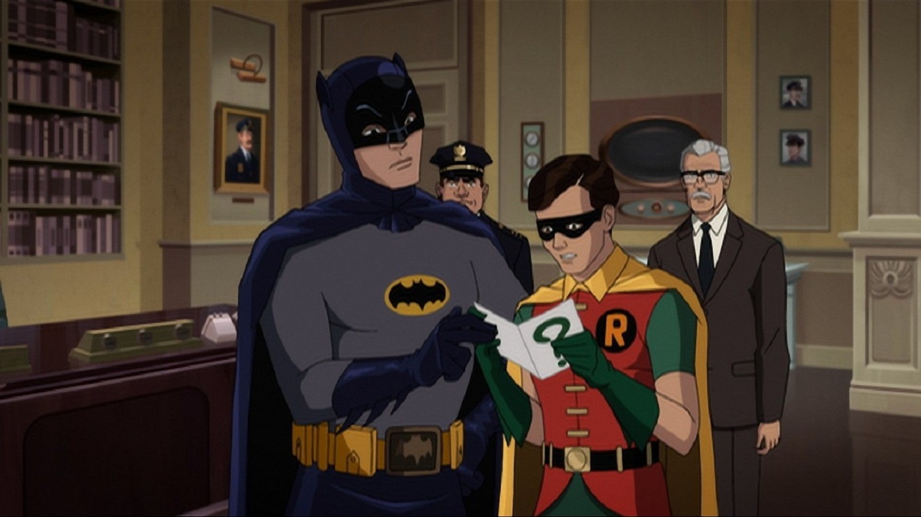 Batman and Robin puzzle over a riddle from The Ridder, while (l to r) Chief O'Hara and Commissioner Gordon look on in the background in Batman Return of the Caped Crusaders (2016)