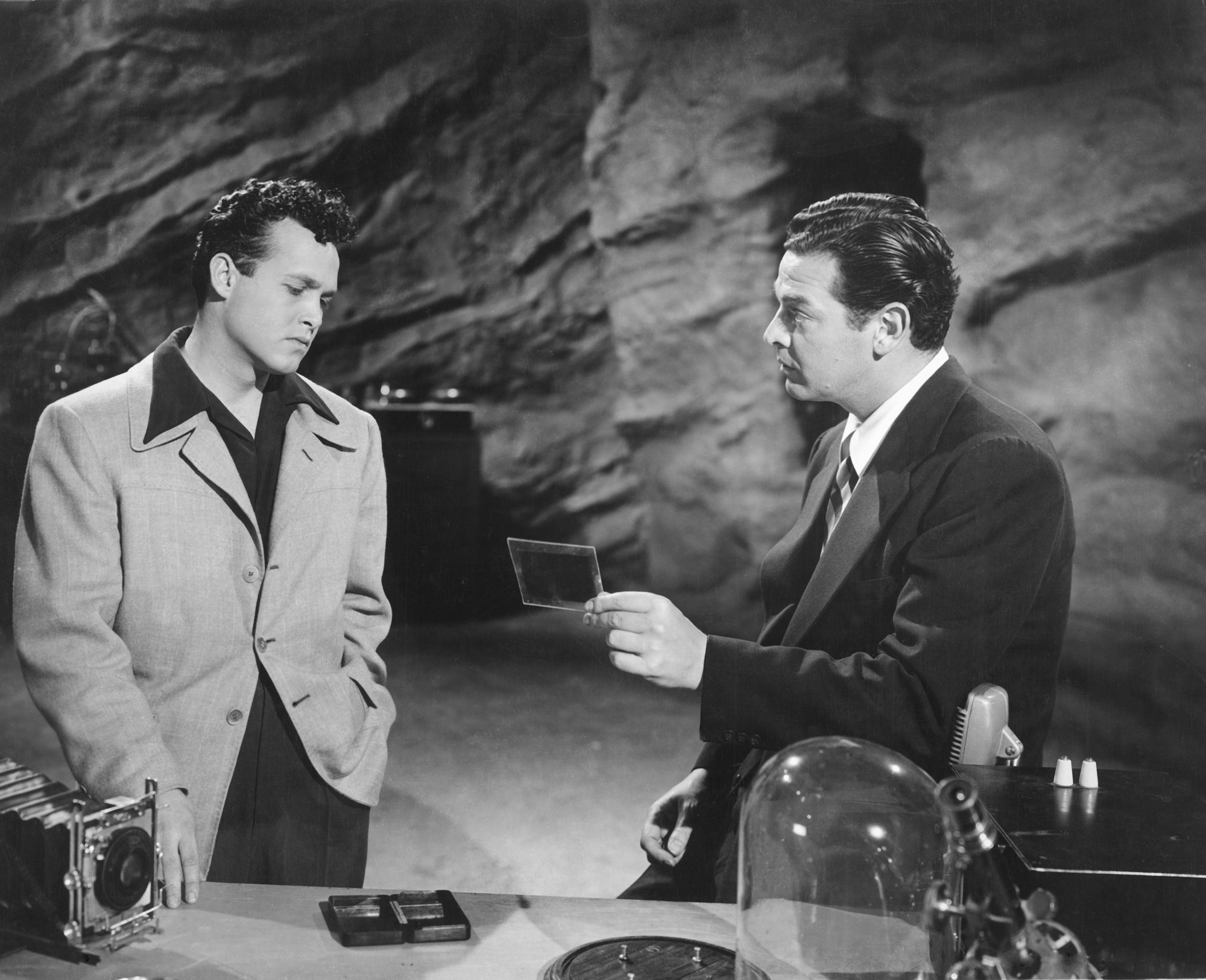 Dick Grayson (John Duncan) and Bruce Wayne (Robert Lowery) in the Batcave in Batman and Robin (1949)