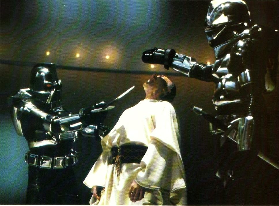 The Cylons execute Count Baltar (John Colicos) in Battlestar Galactica (1978)